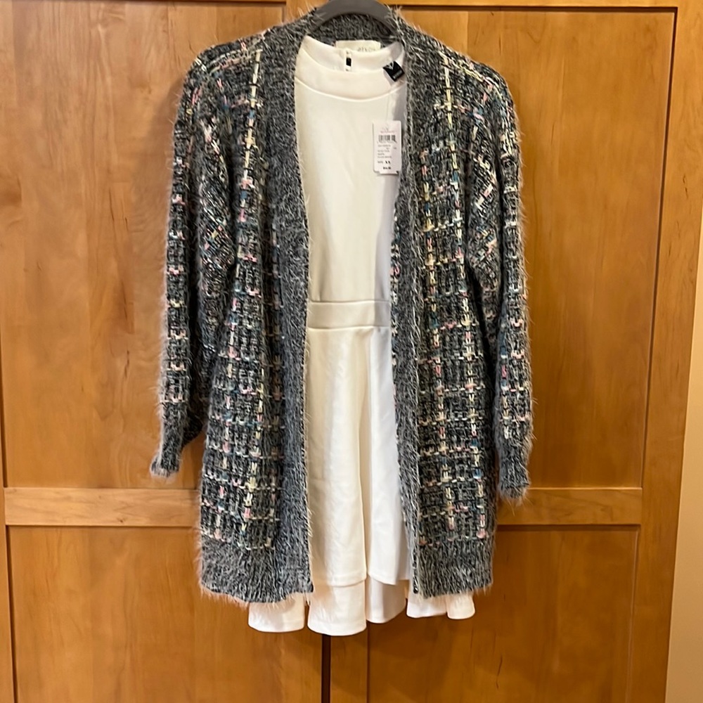 Never worn beautiful lite fluffy sweater perfect for Easter with very colorful.